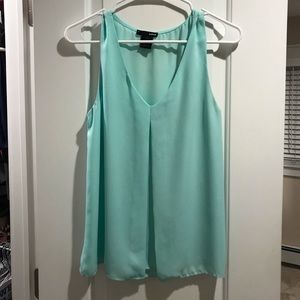 Aqua light blue top. Size small.